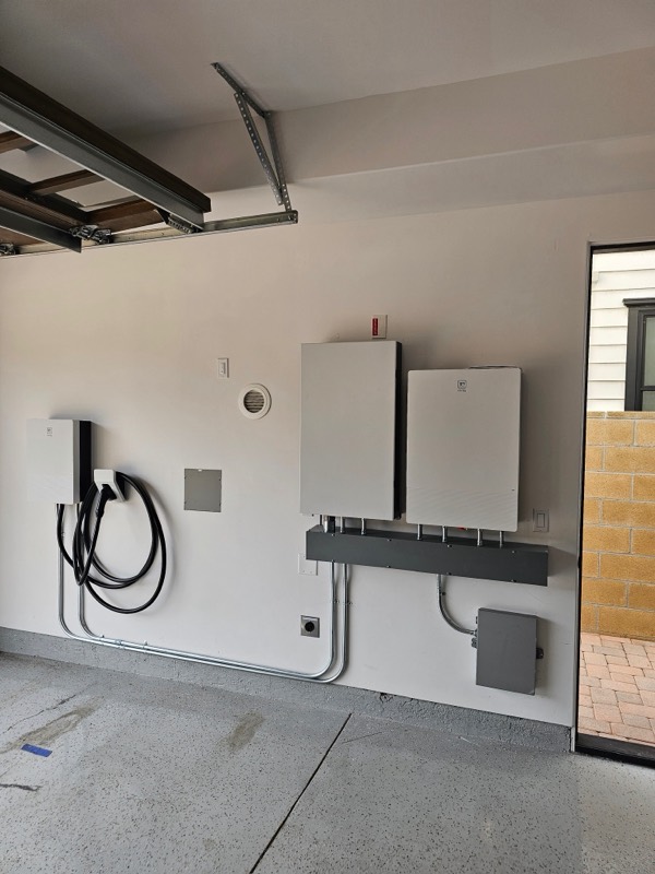 Whole-home battery backup installation in a garage